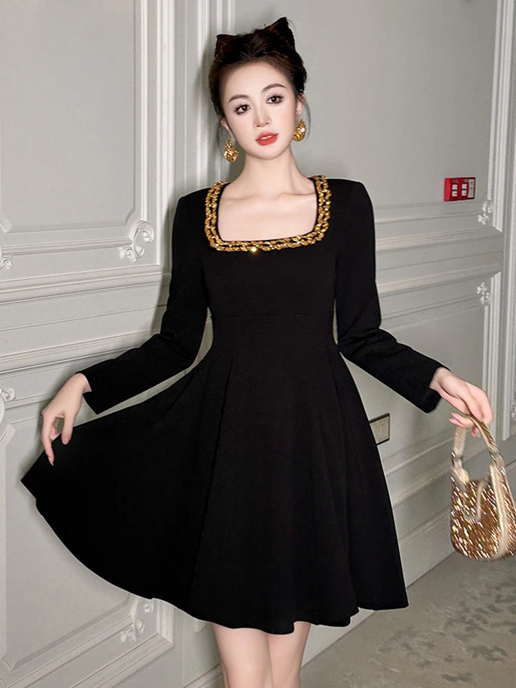 Black Long-sleeve Dress With Gold Accents