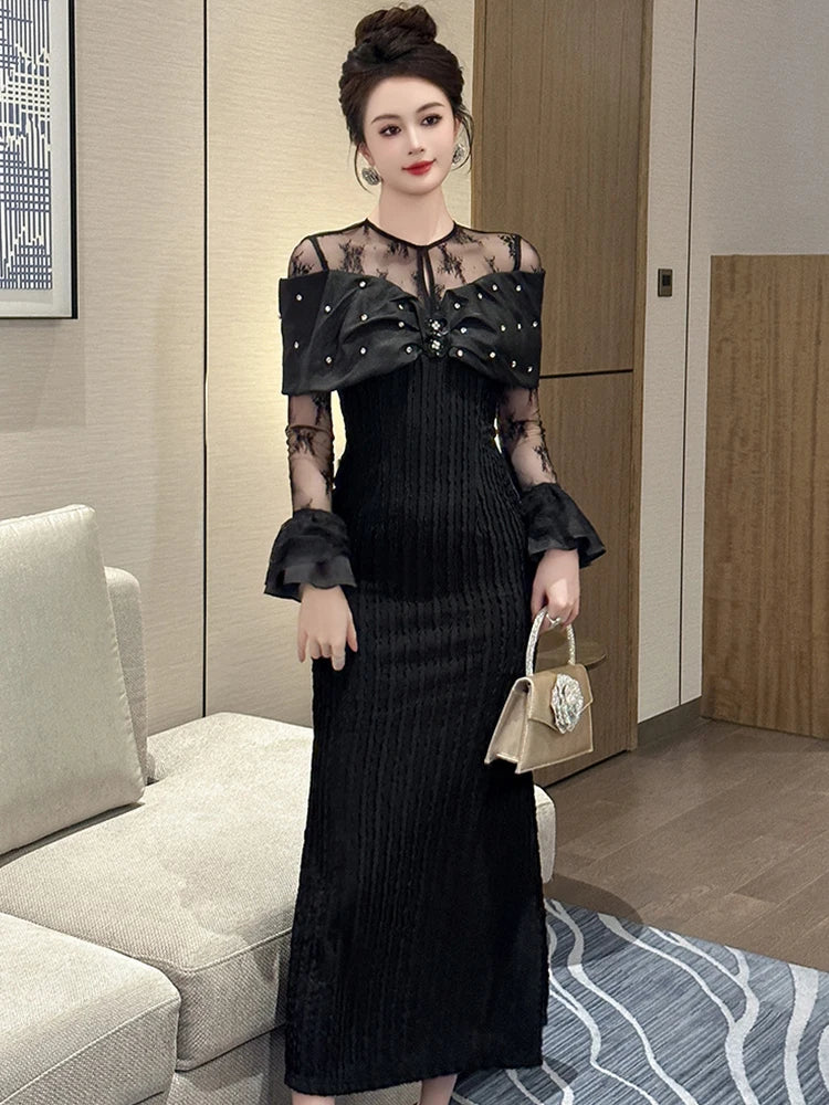 black dress with sheer sleeves and pearls Elegant Black Dress With Sheer Sleeves And Pearls